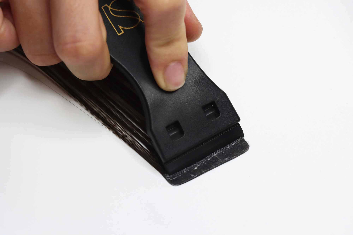 Sophia Hair Extension Tape Scraper being used
